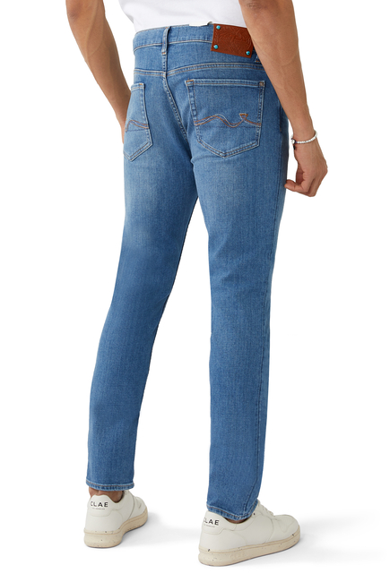 بنطال جينز باكستين قماش معالج مطاطي بإصدار خاص